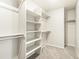 Large walk-in closet featuring ample shelving and hanging space at 1916 S Coolidge Way, Aurora, CO 80018