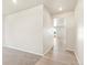 View of a bright hallway with light walls and flooring at 1916 S Coolidge Way, Aurora, CO 80018