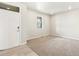 Spacious living room with neutral carpeting and large windows at 1916 S Coolidge Way, Aurora, CO 80018