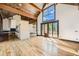 Open concept living room with kitchen and access to the backyard at 964 Alpensee Dr, Breckenridge, CO 80424