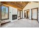 Main bedroom with fireplace, large windows and access to a private deck at 964 Alpensee Dr, Breckenridge, CO 80424