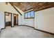 Bedroom with wood-paneled ceiling and en-suite bathroom access at 964 Alpensee Dr, Breckenridge, CO 80424