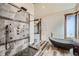 Walk-in shower with marble tile and rainfall shower head at 964 Alpensee Dr, Breckenridge, CO 80424
