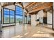 Bright and airy living area with hardwood floors and kitchen access at 964 Alpensee Dr, Breckenridge, CO 80424