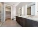 Elegant bathroom with double vanity and a walk-in shower at 4200 W 17Th Ave # 11, Denver, CO 80204