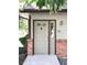 Front door of a home with a brick exterior and a concrete walkway at 11041 Huron St # 706, Northglenn, CO 80234