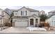 Two-story house with attached garage and landscaping at 2898 Night Song Way, Castle Rock, CO 80109