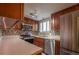 Updated kitchen with stainless steel appliances and wood cabinetry at 8060 W 9Th Ave # 103, Lakewood, CO 80214