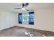 Bedroom with ceiling fan, window, and carpet flooring at 436 S Carr St, Lakewood, CO 80226