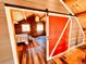 Cozy loft bedroom with wood walls and sliding barn door at 13640 Old Paint Trl, Conifer, CO 80433