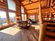 Open-concept living room with loft and mountain views at 13640 Old Paint Trl, Conifer, CO 80433