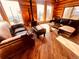 Living room with leather sofas and mountain views at 13640 Old Paint Trl, Conifer, CO 80433