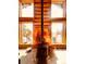 Wood-burning stove with copper surround and mountain views at 13640 Old Paint Trl, Conifer, CO 80433
