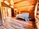 Bright bedroom with wood-beamed ceiling and en-suite bath at 13640 Old Paint Trl, Conifer, CO 80433