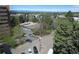 Aerial view showing a tennis court and mountain views at 8060 E Girard Ave # 711, Denver, CO 80231