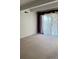 Bright living room featuring carpet and sliding glass doors at 8060 E Girard Ave # 711, Denver, CO 80231