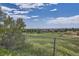 Open green space with distant city view at 13305 W 82Nd Ave, Arvada, CO 80005