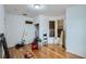 Unfinished bedroom with hardwood floors, and new door and window at 13305 W 82Nd Ave, Arvada, CO 80005