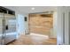 Kitchen with stainless steel refrigerator and unfinished area at 13305 W 82Nd Ave, Arvada, CO 80005