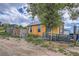 Under construction home with wood siding and a partial fence at 13305 W 82Nd Ave, Arvada, CO 80005