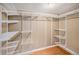 Spacious walk-in closet with ample shelving and hanging rods at 28532 Shadow Mountain Dr, Conifer, CO 80433