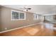 Spacious living room with hardwood floors and ceiling fan at 28532 Shadow Mountain Dr, Conifer, CO 80433
