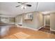 Open concept living room with hardwood floors and kitchen bar at 28532 Shadow Mountain Dr, Conifer, CO 80433
