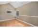 Bright bedroom featuring hardwood floors and a large window at 28532 Shadow Mountain Dr, Conifer, CO 80433