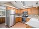 Kitchen with stainless steel appliances and skylight at 28532 Shadow Mountain Dr, Conifer, CO 80433
