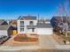 Two-story house with attached garage and landscaped yard at 19695 E Amherst Dr, Aurora, CO 80013