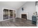 Living room with fireplace and sliding doors to deck at 19695 E Amherst Dr, Aurora, CO 80013