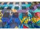 Secure parking garage access with a vibrant mural at 100 Park Ave # 204, Denver, CO 80205