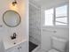 Clean bathroom with marble shower and vanity at 8465 Wheatgrass Cir, Parker, CO 80134