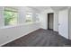 Finished basement bedroom with carpet flooring, double door closet and windows at 8465 Wheatgrass Cir, Parker, CO 80134