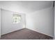 Simple bedroom with carpet flooring and a window at 8465 Wheatgrass Cir, Parker, CO 80134