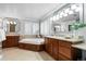 Spa-like bathroom with soaking tub and double vanity at 2504 S Fenton Ln, Lakewood, CO 80227