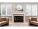 Elegant fireplace with a modern mirror above the mantle at 2504 S Fenton Ln, Lakewood, CO 80227