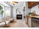 Relaxing sitting area with fireplace and built-in wet bar at 2504 S Fenton Ln, Lakewood, CO 80227