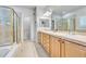 Elegant bathroom with double vanity and large shower at 7193 S Versailles Way, Aurora, CO 80016