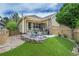 Relaxing back patio with artificial turf, seating area, and privacy fence at 7193 S Versailles Way, Aurora, CO 80016