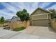 Two-car garage with ample storage and a ramp at 7193 S Versailles Way, Aurora, CO 80016