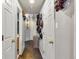 Bright hallway with several doors and a unique hat display at 11384 Oakland Dr, Commerce City, CO 80640
