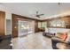 Spacious living room with wood-paneled walls and tile floors at 175 S Clay St, Denver, CO 80219