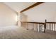 Spacious loft area with high ceilings and wood railings at 10890 W Evans Ave # 3D, Lakewood, CO 80227