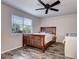 Bedroom with wood-look flooring and ceiling fan at 4197 Deer Watch Dr, Castle Rock, CO 80104