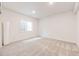 Spacious unfinished basement room with carpeted floor at 3839 Buchanan Way, Aurora, CO 80019