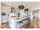 Modern kitchen with island, stainless steel appliances, and pendant lighting at 3839 Buchanan Way, Aurora, CO 80019