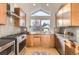 Modern kitchen features stainless steel appliances and light wood cabinets at 3936 Bosque Ct, Boulder, CO 80301