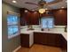 Updated kitchen with dark wood cabinets, white countertops, and cork flooring at 5025 S Huron St, Englewood, CO 80110