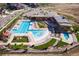 Aerial view of community pool with adjacent clubhouse and lounge area at 1165 Sugarloaf Ln, Erie, CO 80516